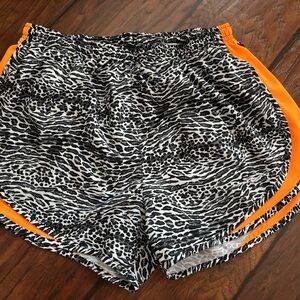 Nike Women's Black and White Patterned Shorts with Orange Trim